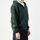ESTD.2026 Balloon Zip Hoodie Green – On model side | Tapered hem balloon sleeves thumbnail